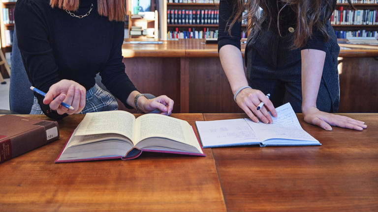 Library students books closeup
