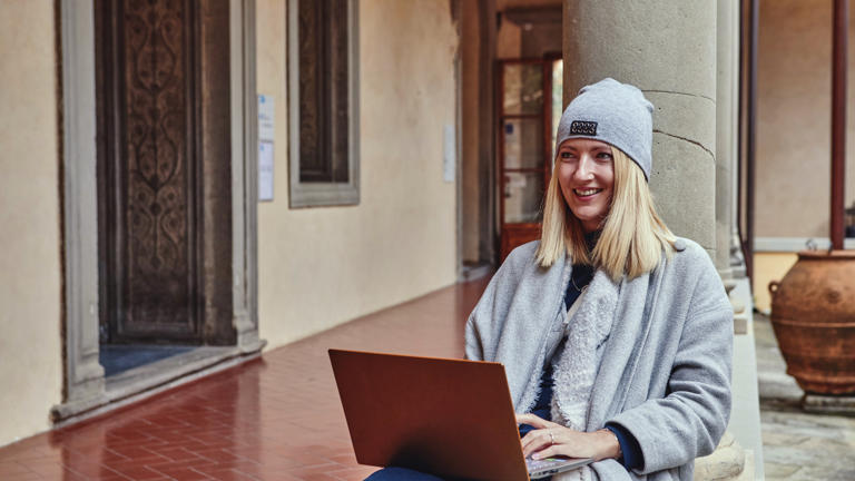 Researcher working on notebook no mask